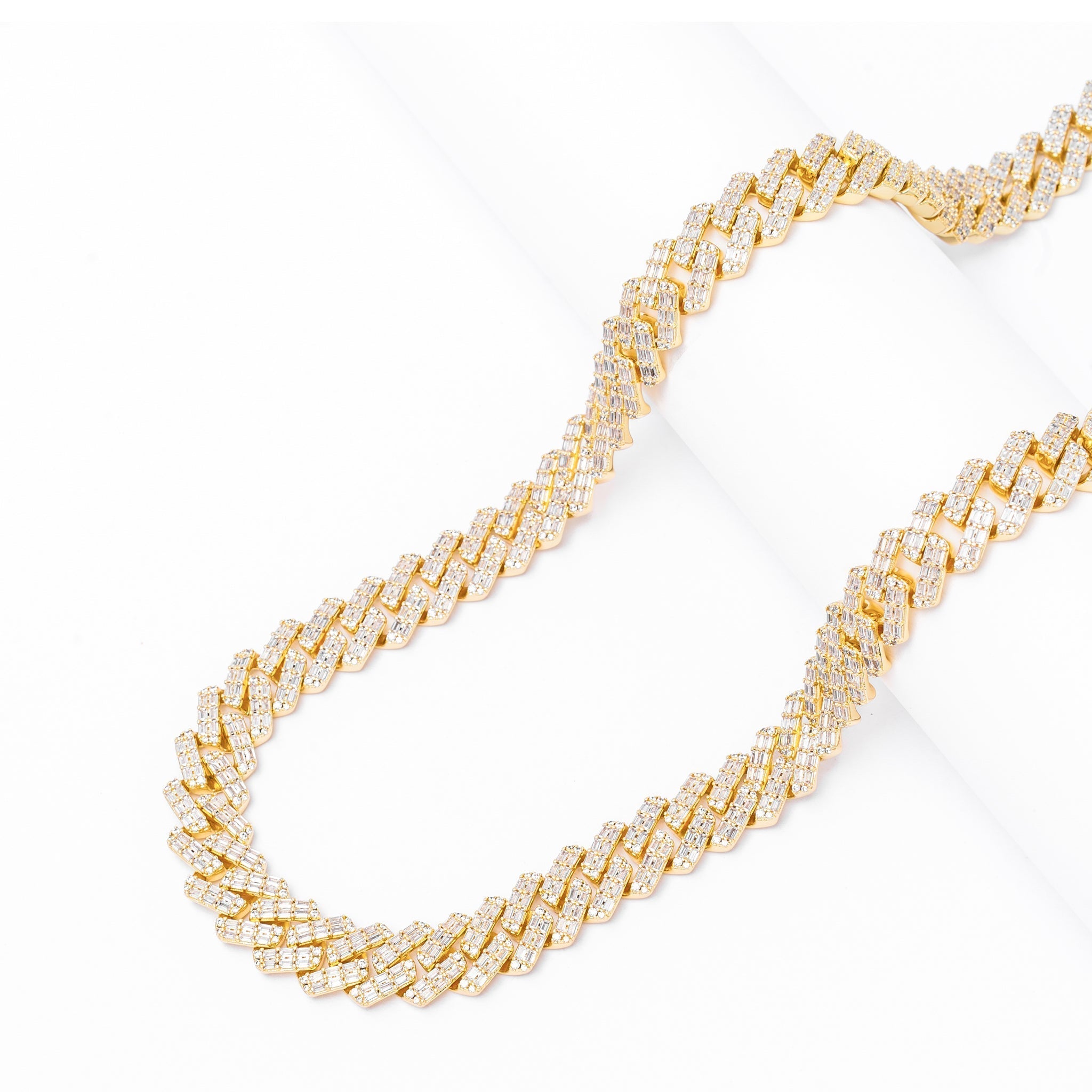 Angled view of 12MM gold Cuban chain with full diamond coverage and iced-out design