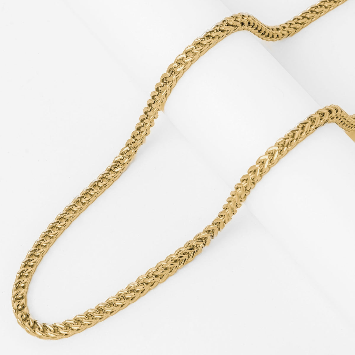 Gold rope chain texture and weave detail close-up