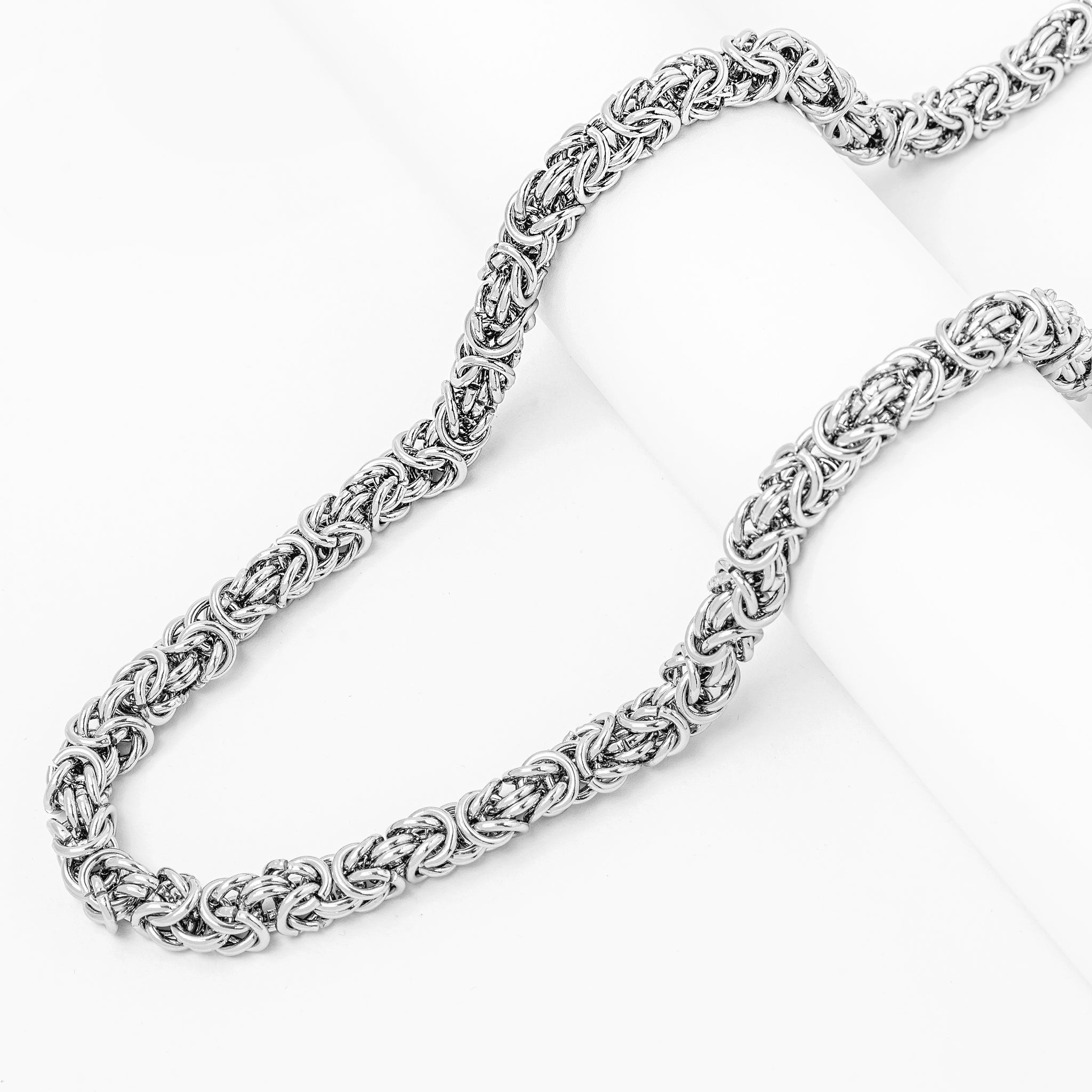 Two Big Daddy 8MM Byzantine silver steel chains displayed side by side