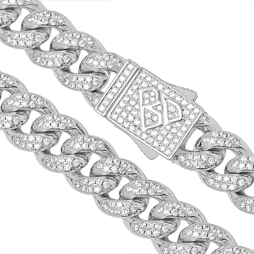 Close-up detail of Cuban link with iced out cubic zirconia and branded clasp