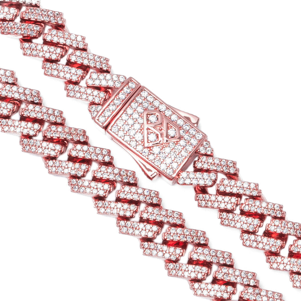 Cuban link chain detail with iced out crystals and logo clasp closeup