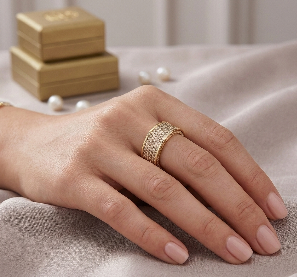 Big Daddy Boujee diamond iced out ring worn on hand with gold gift boxes