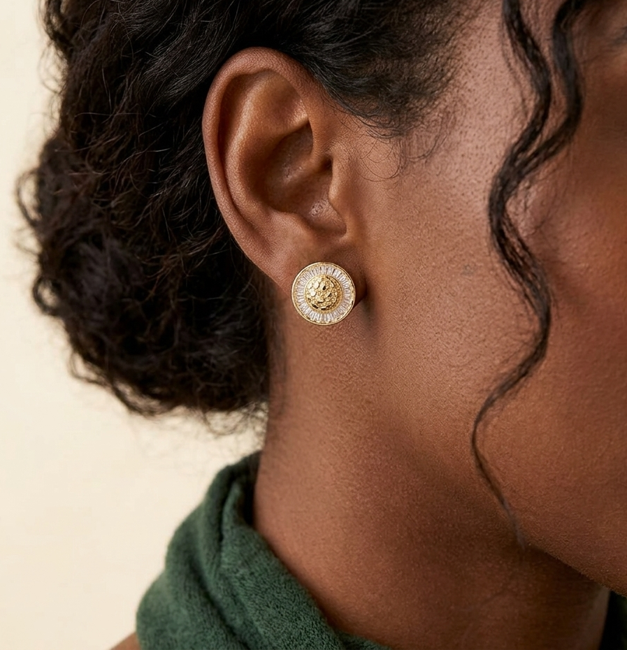 Gold cluster baguette iced out diamond earring worn on ear
