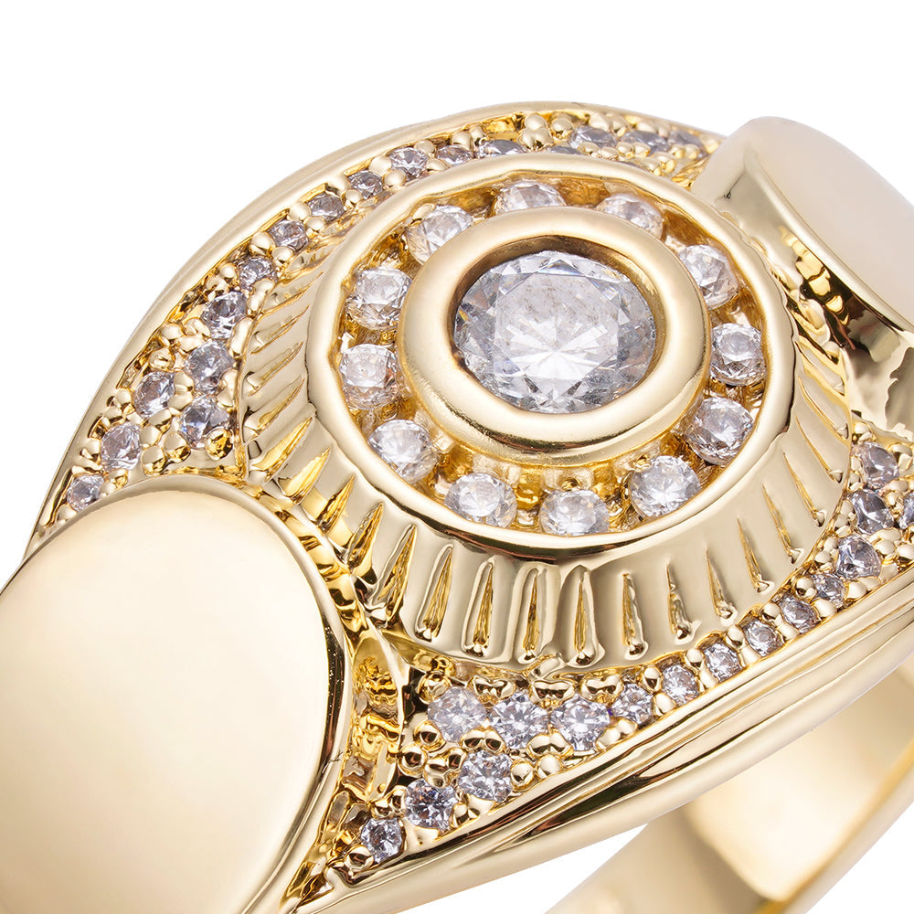 Close-up detail of center diamond with halo setting and pave diamonds on gold signet ring