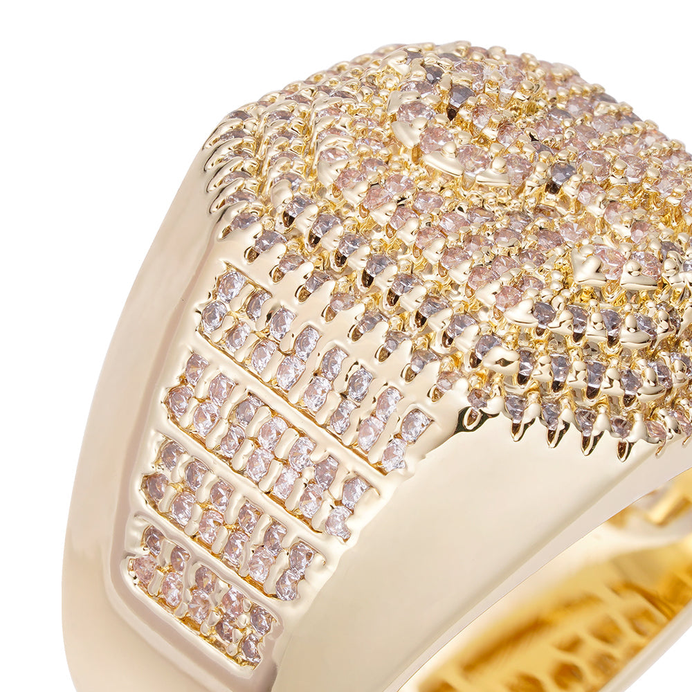 Angled close-up of dollar sign iced out ring showing cubic zirconia crystal detail and gold setting