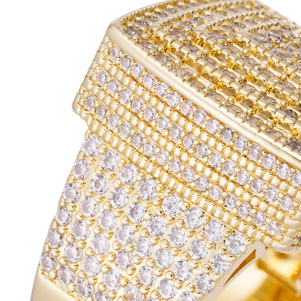 Close-up angle view of iced out diamond ring showing cubic zirconia pave detailing and gold band
