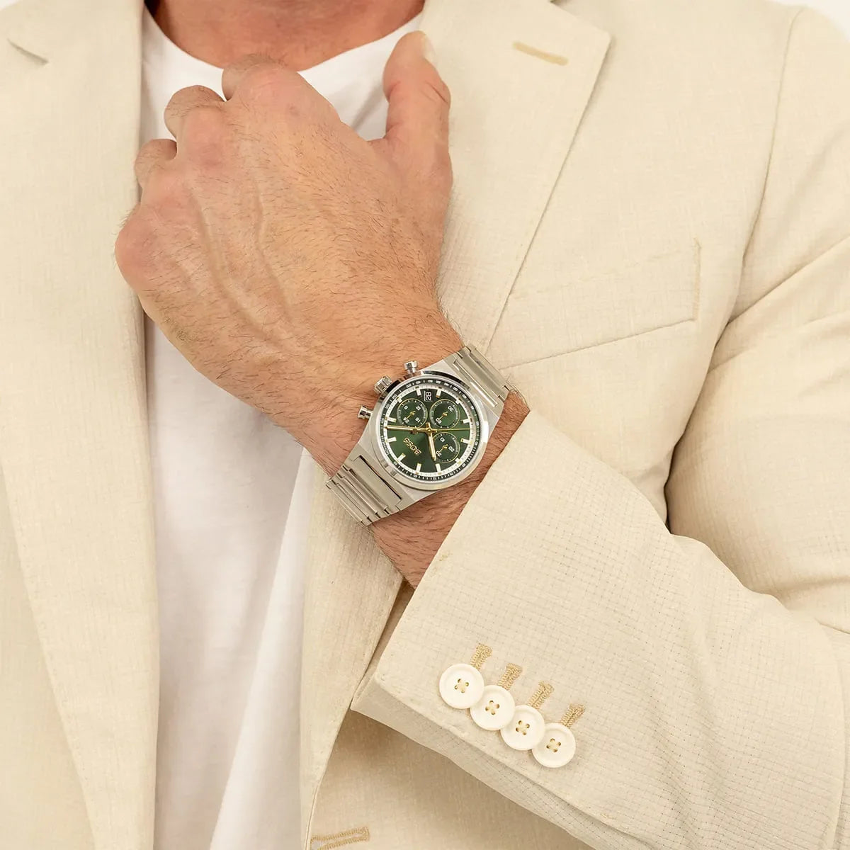BOSS stainless steel chronograph watch on wrist over beige blazer