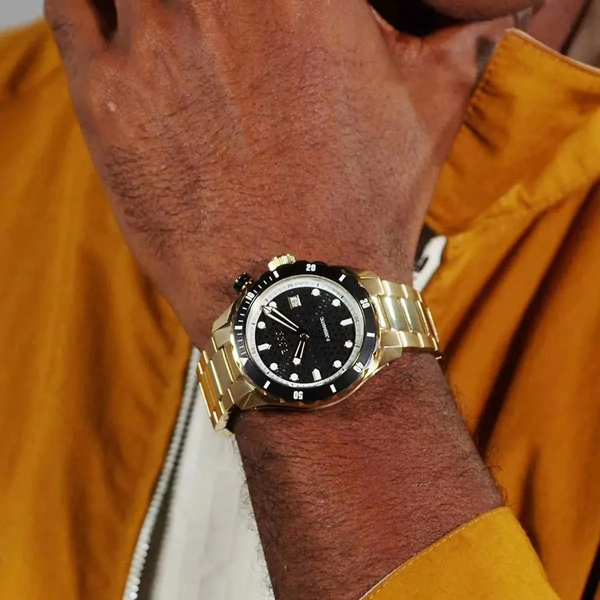 BOSS Bossmatic automatic watch worn on wrist with black dial and gold metal bracelet