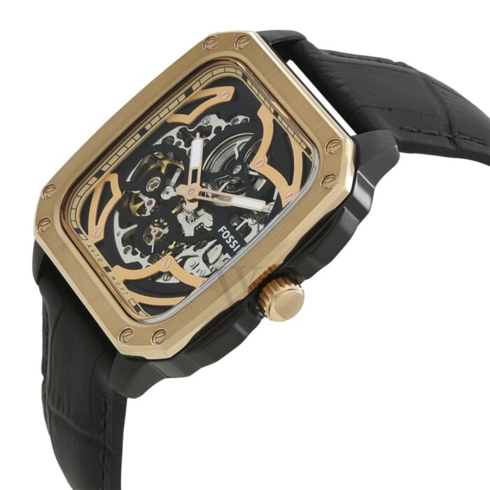 Angled view of Fossil Inscription automatic skeleton dial watch on wrist