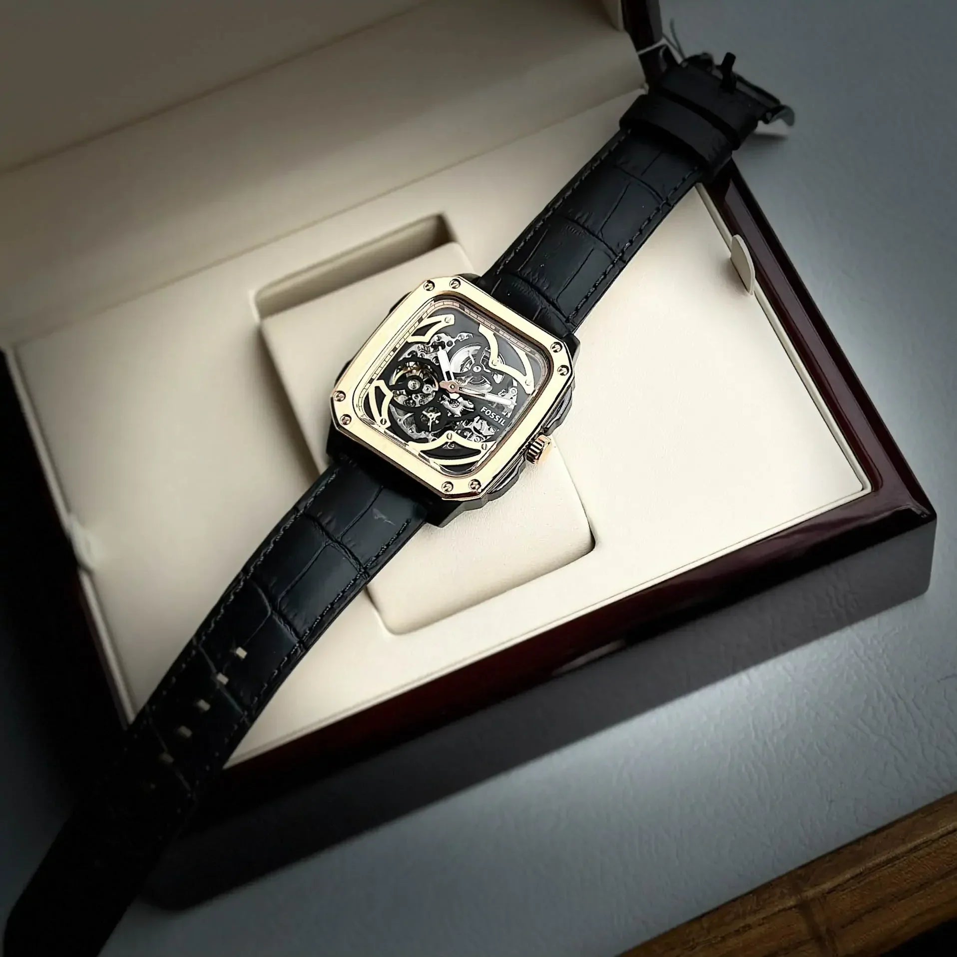 Fossil Inscription watch displayed in presentation box