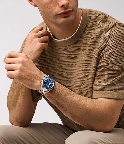 Fossil Autocross watch worn on wrist with blue dial and silver stainless steel case