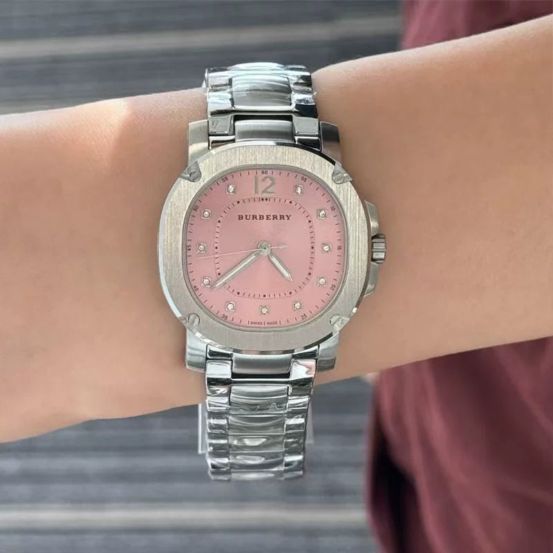 Burberry Britain women's watch with silver steel bracelet worn on wrist
