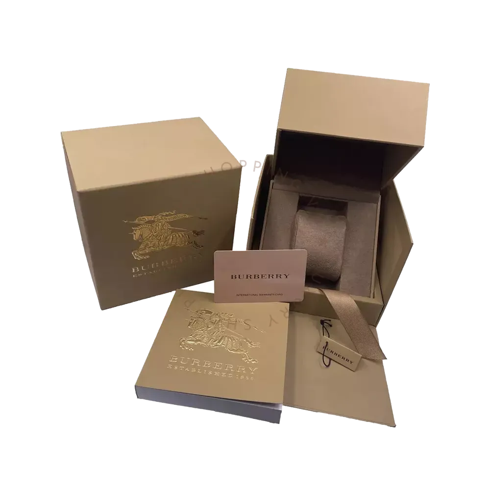Burberry watch packaging with tan box, documentation, and branded gift accessories