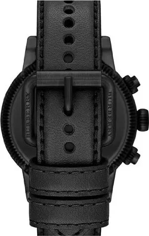 Black leather strap with pin buckle closure and case back detail of Burberry chronograph watch