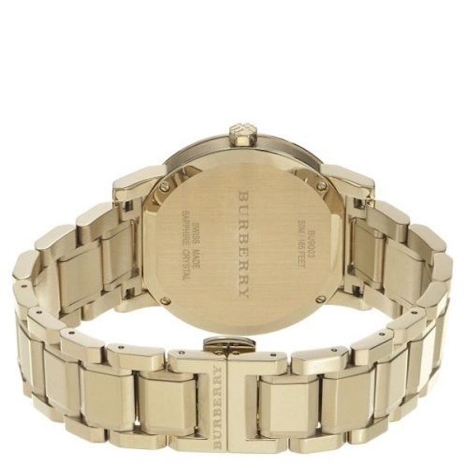 Burberry BU9003 yellow gold-plated case back showing bracelet attachment