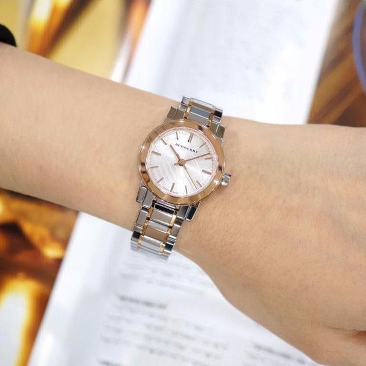 Burberry City Check watch worn on wrist showing silver dial and two-tone bracelet design