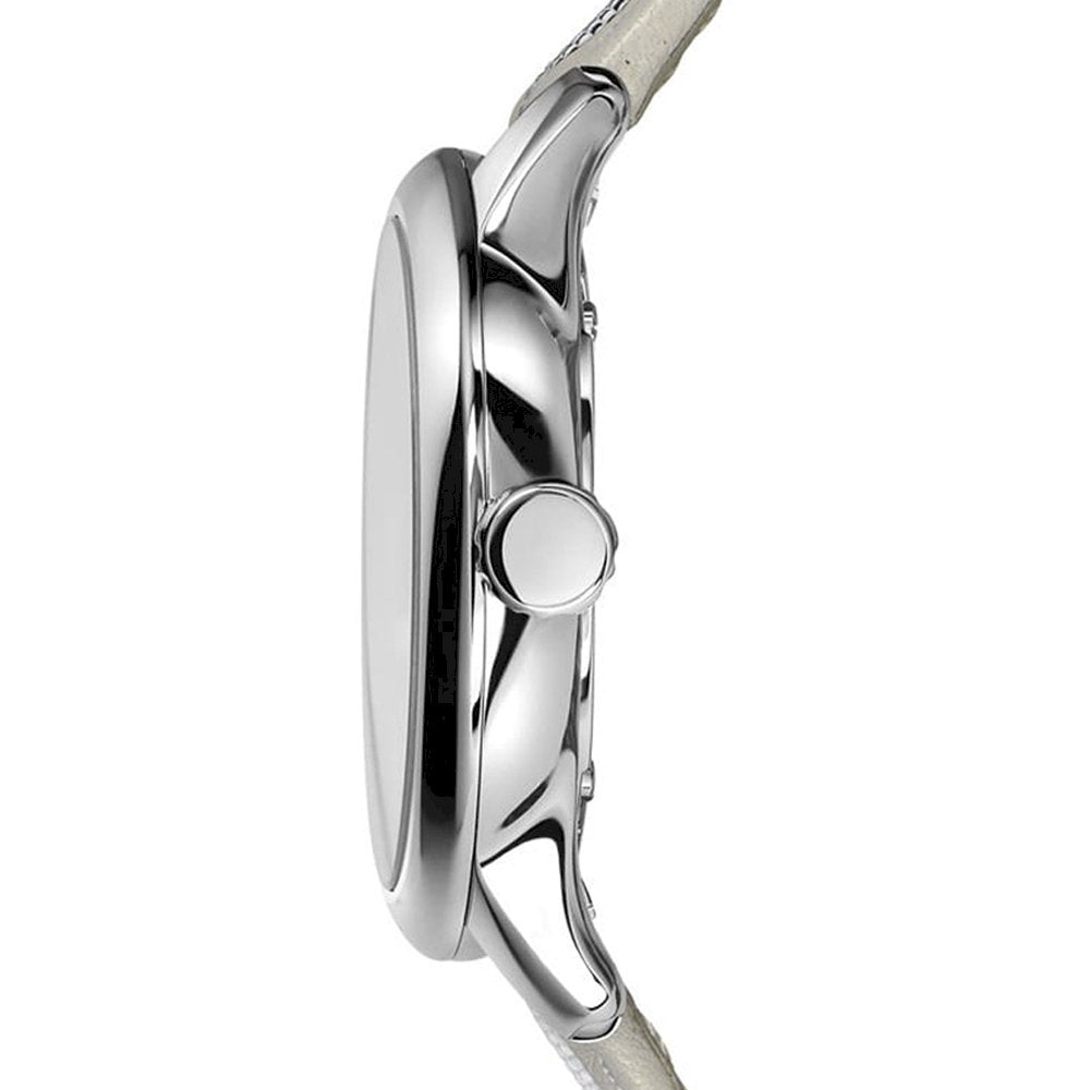 Side profile of silver watch case with polished finish and cream strap