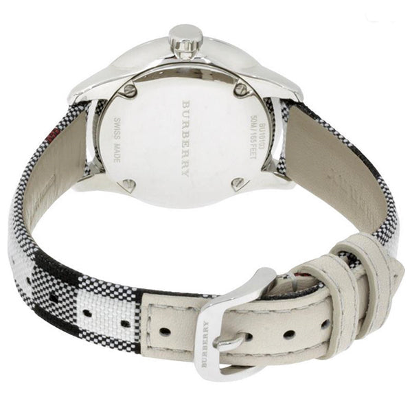 Burberry watch caseback with stainless steel back and fabric strap detail