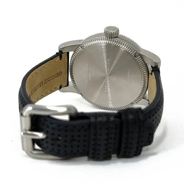 Burberry GMT caseback with textured engraving and tan leather strap visible