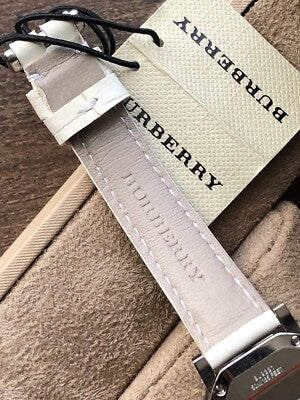 Burberry The City watch packaging with branded box and white leather strap
