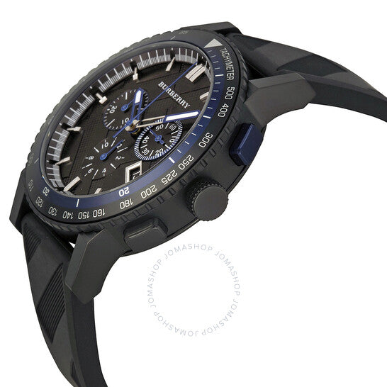 Angled view of Burberry The City chronograph with blue tachymeter scale and black rubber strap