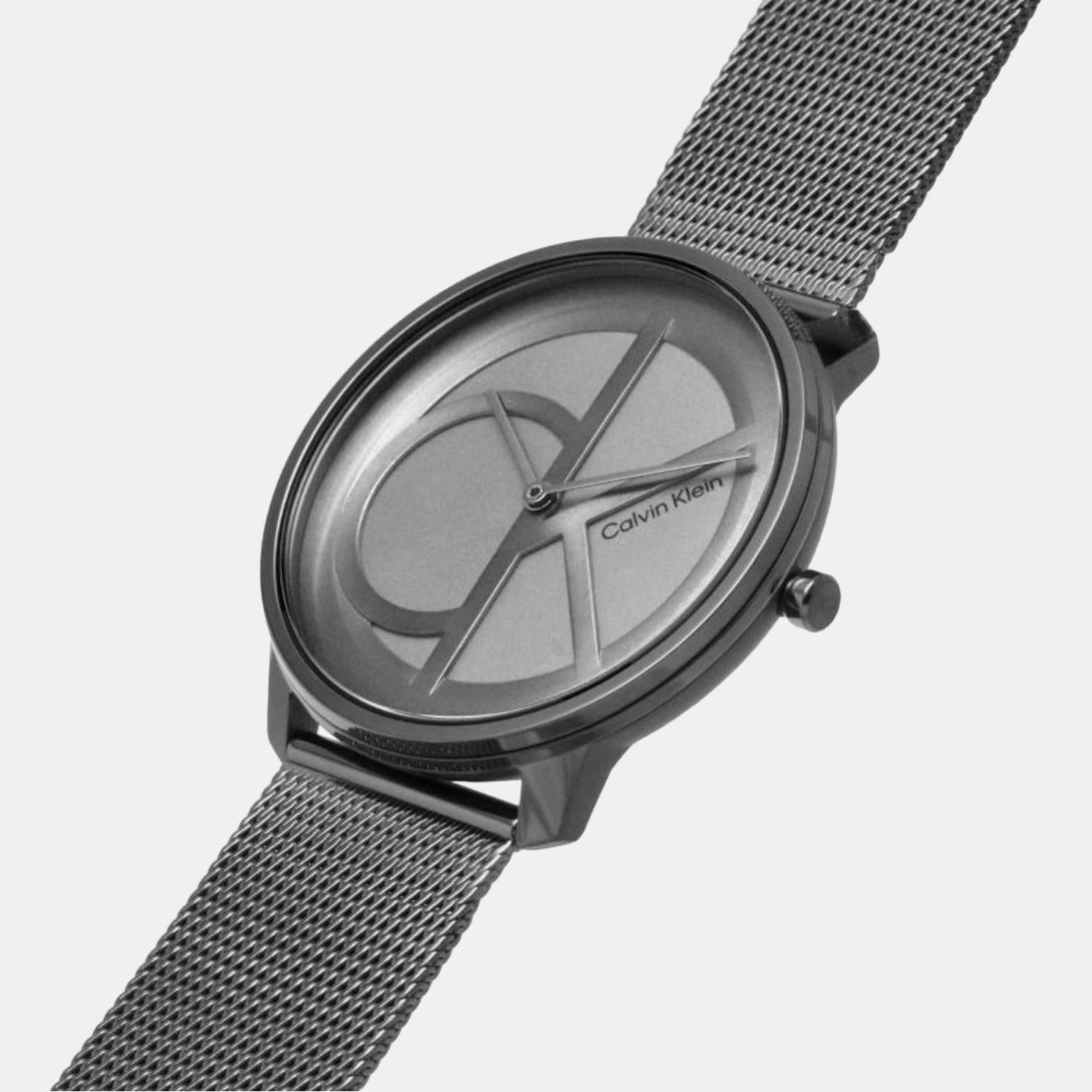 Angled view of Calvin Klein grey dial watch on gunmetal mesh strap