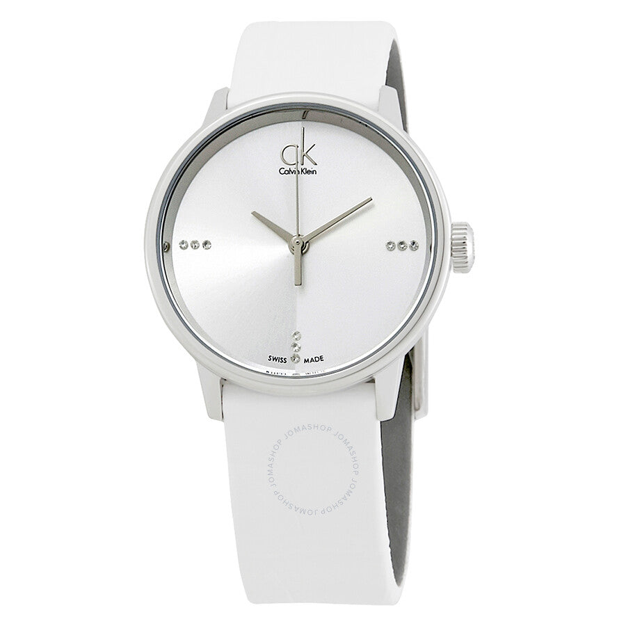 Calvin Klein Accent watch on wrist showing white dial with diamond markers and white strap