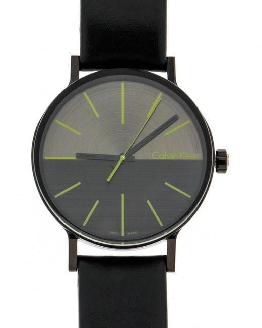 Front view of Calvin Klein Boost watch showing black dial and lime accents