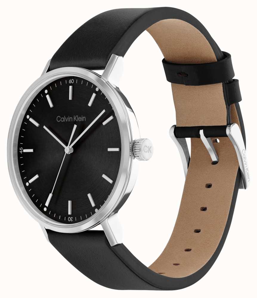 Calvin Klein City watch on wrist showing black leather strap and silver case