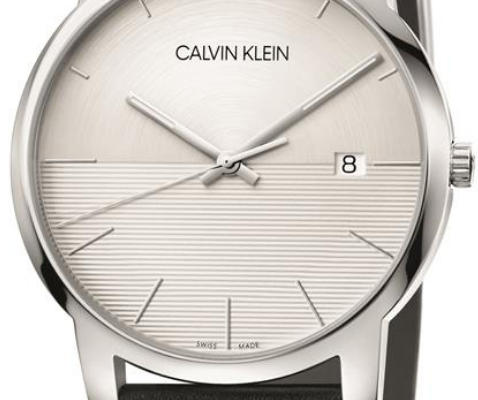 Close-up of white dial showing minimalist design with horizontal texture and date window