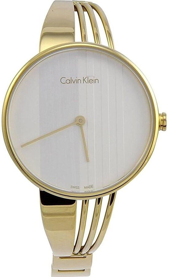 Side view of gold steel bangle watch with silver dial and gold hands