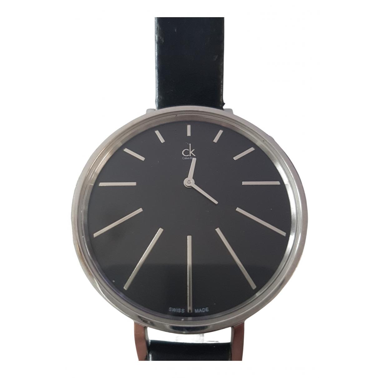Calvin Klein Equal K3E231C1 watch worn on wrist with black leather strap