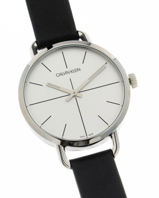 Calvin Klein Even watch worn on wrist showing silver dial with black leather strap