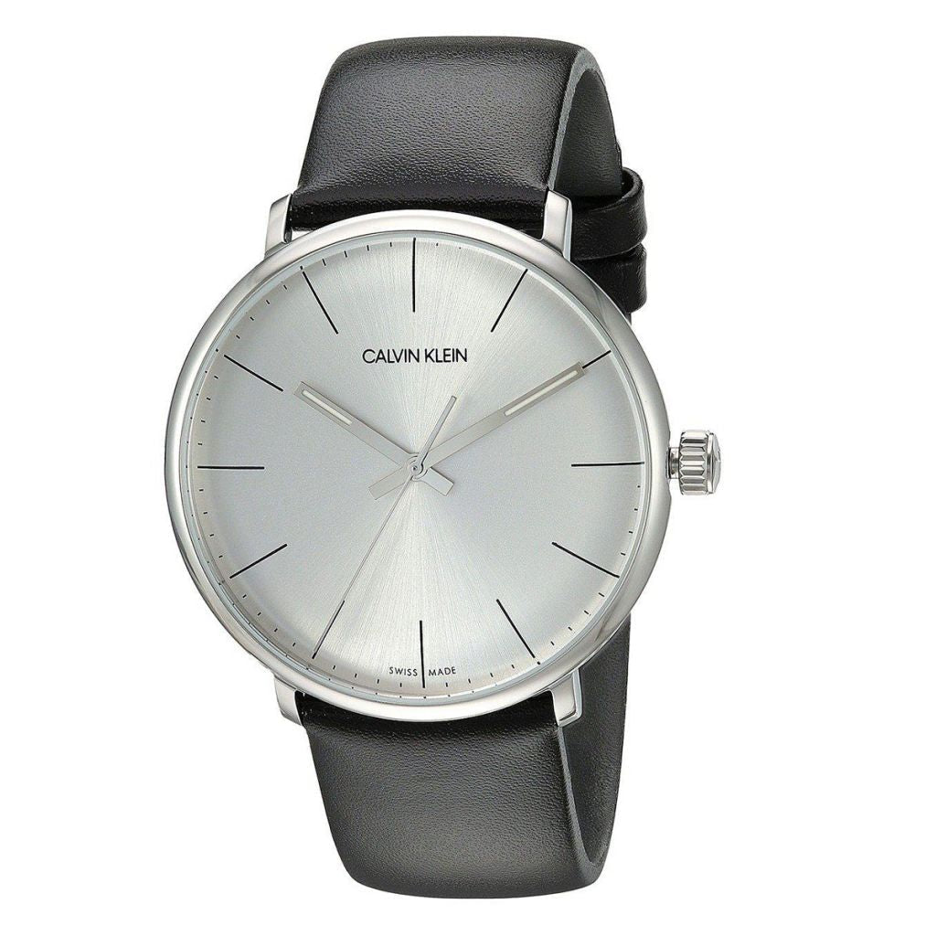 Calvin Klein High Noon watch worn on wrist with white dial and black leather strap