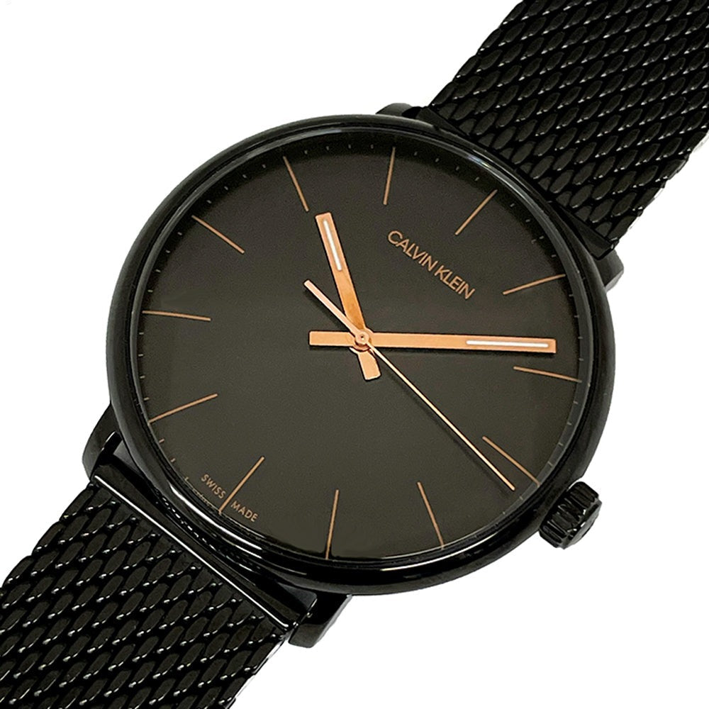 Angled view of Calvin Klein High Noon watch showing black mesh bracelet and case