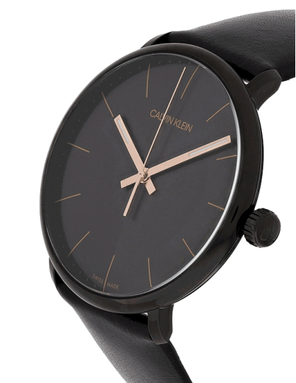 Calvin Klein High Noon men's watch worn on wrist showing minimalist black dial with rose gold accents