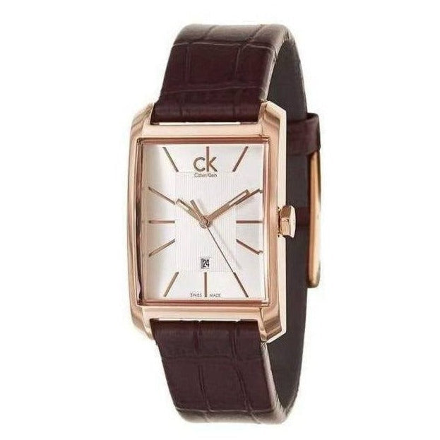 Calvin Klein K2M23620 on wrist showing silver dial, rose gold case, brown crocodile leather strap