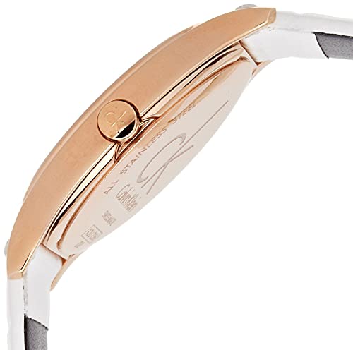 Angled side view of Calvin Klein watch case and crown with white strap