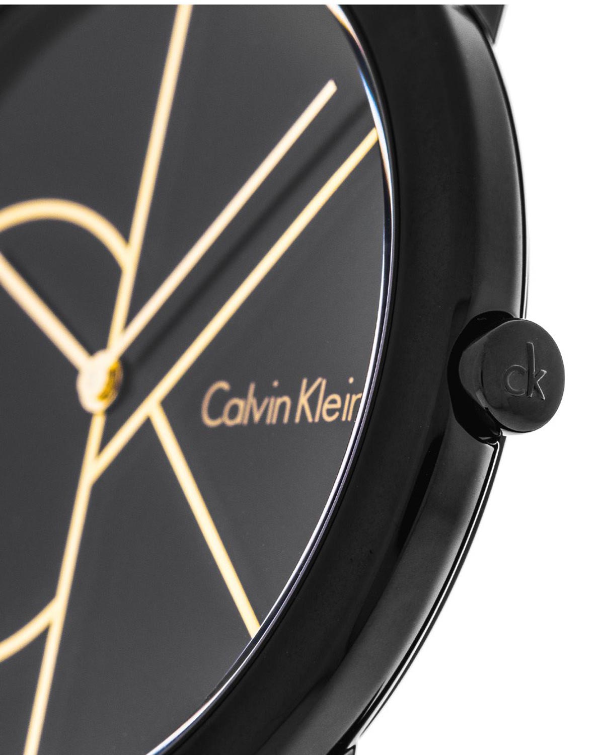 Close-up of black dial with gold geometric indices, Calvin Klein branding and crown detail