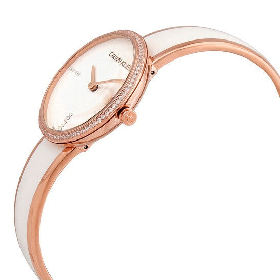 Side profile of Calvin Klein Seduce watch showing slender white leather strap and rose gold-tone case