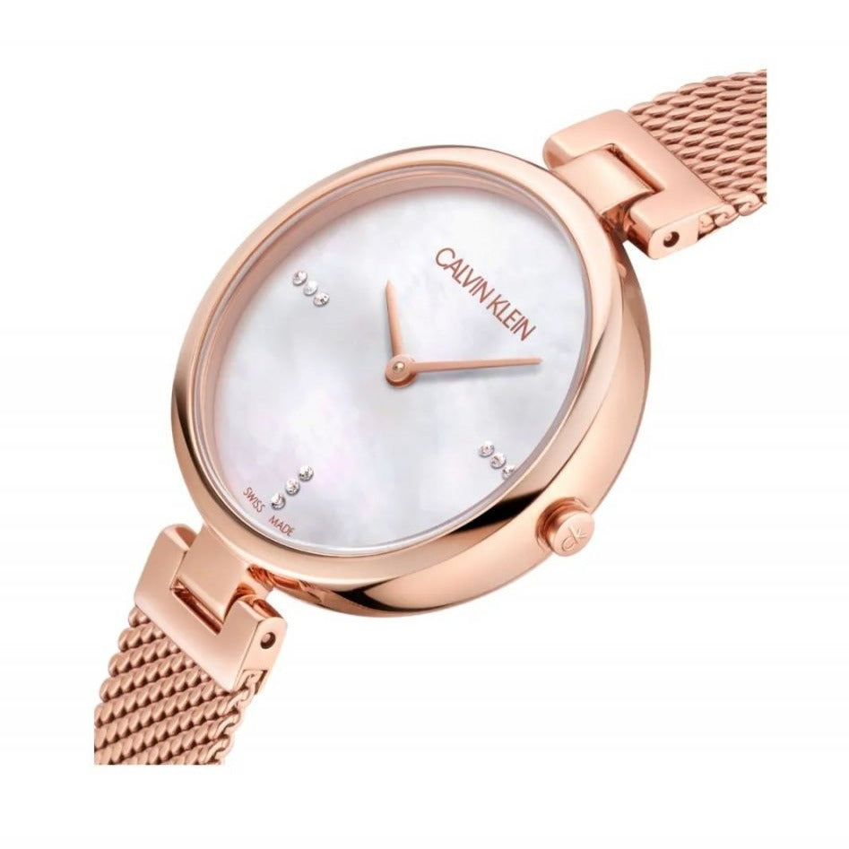 Angled view of rose gold watch with mesh bracelet