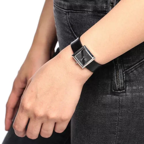 Calvin Klein Mark women's watch worn on wrist with black dial and black leather strap