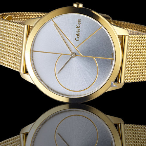 Calvin Klein Minimal 40mm watch shown from side angle with gold mesh bracelet and geometric dial design visible