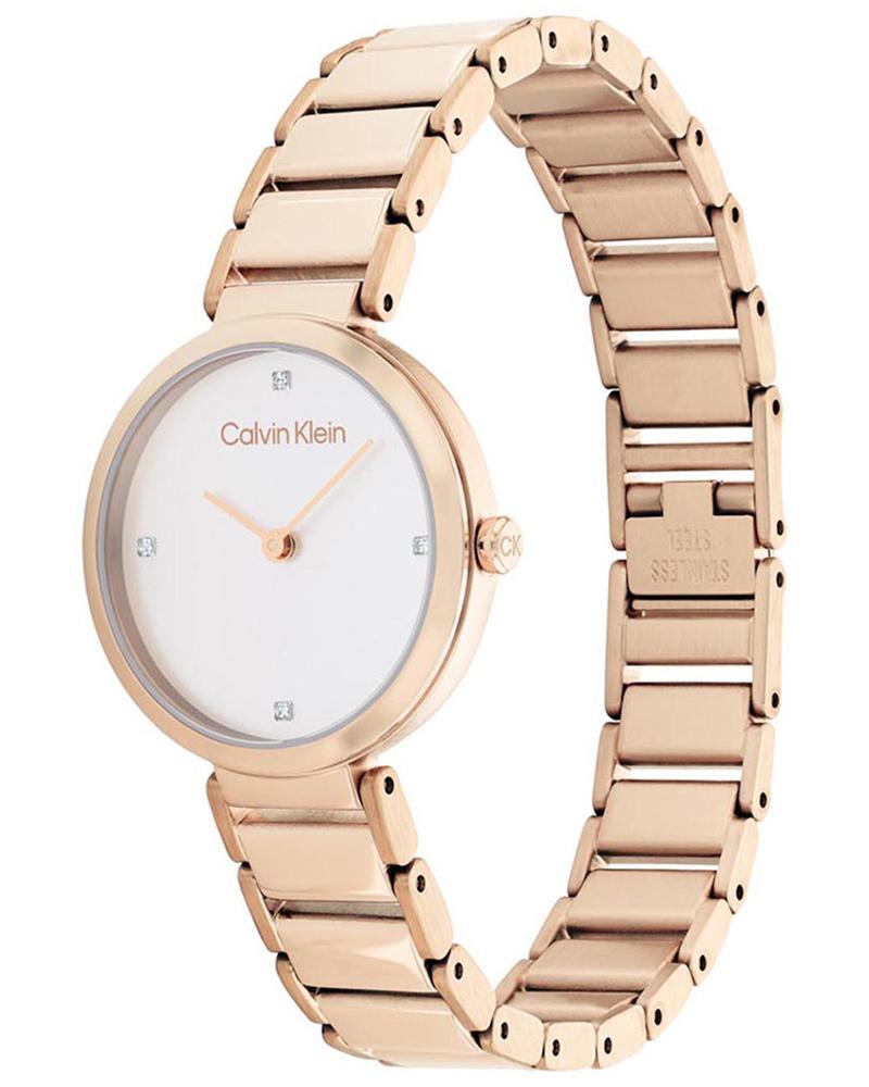 CALVIN KLEIN T Bar gold watch at angle showing white dial and full bracelet