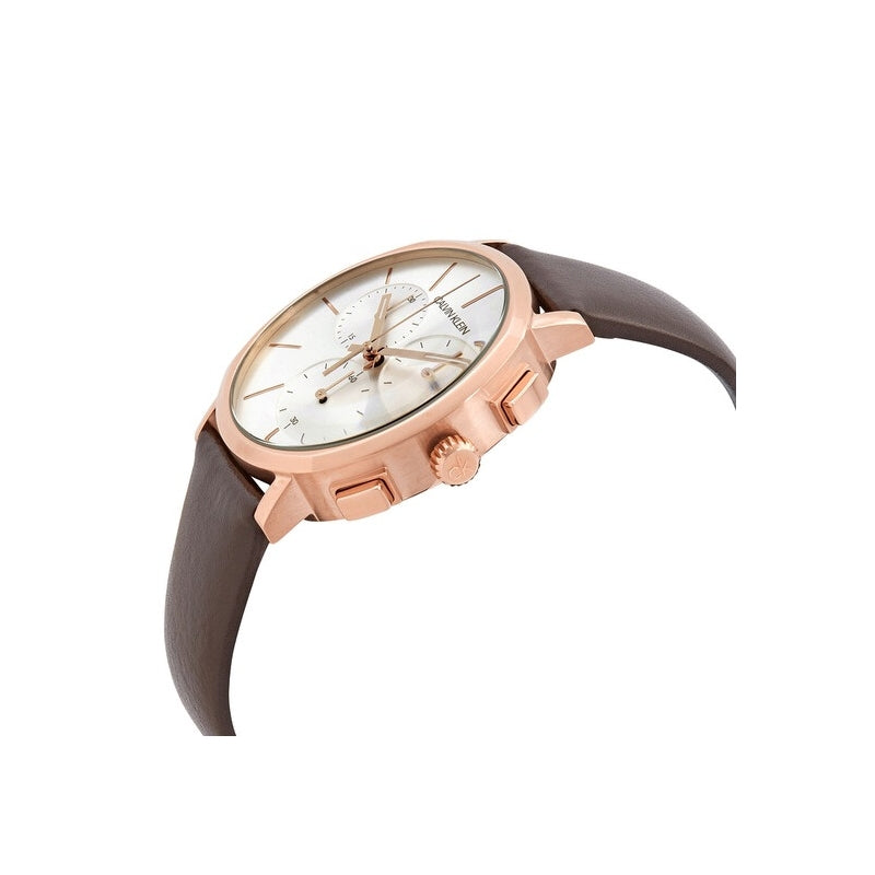 Three-quarter view of Calvin Klein Posh chronograph watch with white dial and rose gold case