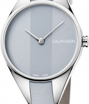 Close-up of Calvin Klein Rebel light grey dial with minimalist hands and indices