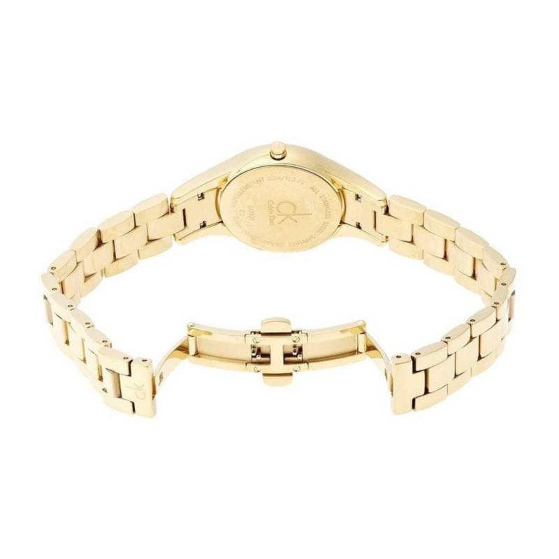 Calvin Klein Simplicity watch case back showing gold-tone metal surface