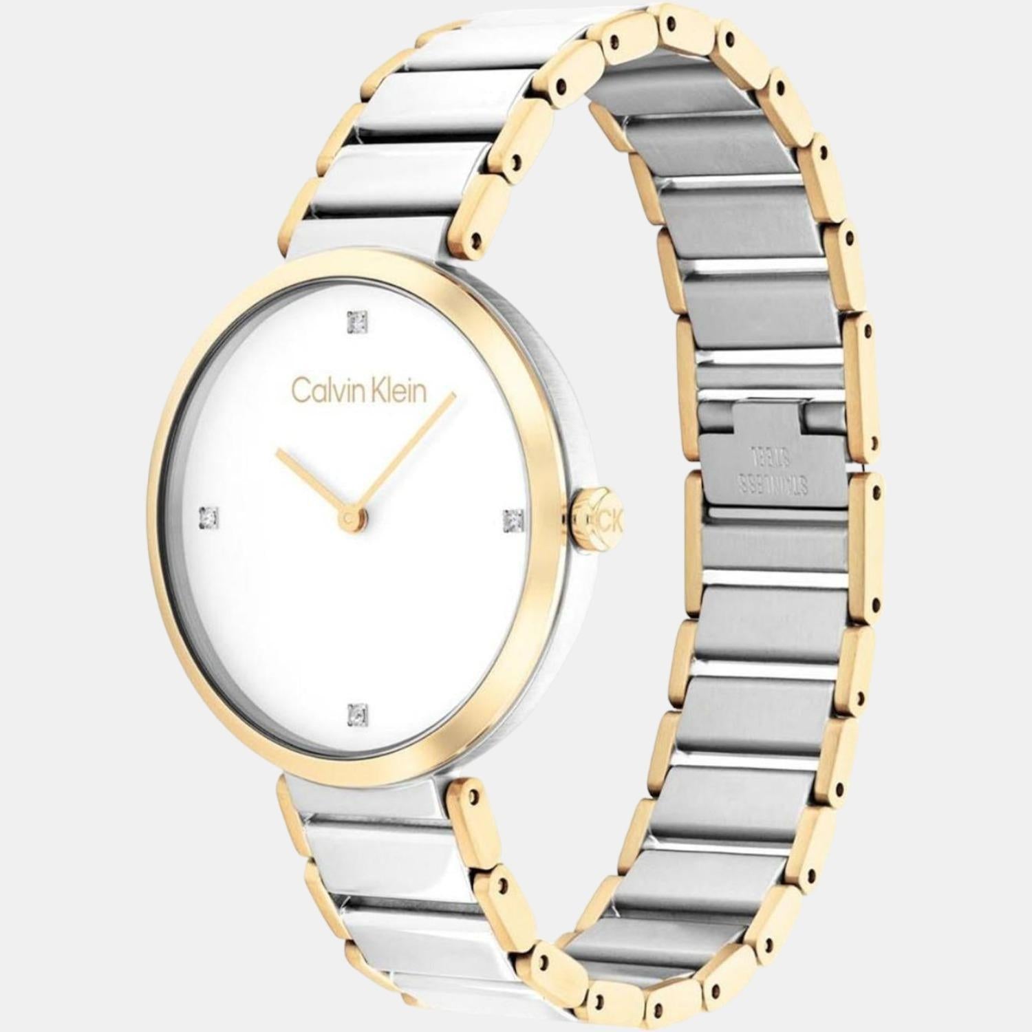 Side profile of Calvin Klein Stately watch displaying two-tone steel and gold bracelet detail