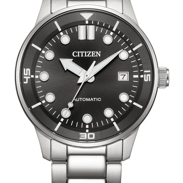 Close-up of black dial with hour markers, date window, and silver hands