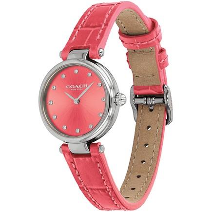 Coach women's watch on wrist showing pink crocodile-embossed leather strap and silver buckle